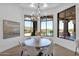 Charming breakfast nook with a round table and chairs, offering scenic views at 11475 E Paradise Ln, Scottsdale, AZ 85255