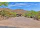 Long driveway leading to a beautiful home in the hills at 11475 E Paradise Ln, Scottsdale, AZ 85255