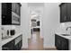 Modern butler's pantry with custom cabinetry and appliances at 11475 E Paradise Ln, Scottsdale, AZ 85255