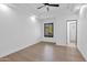 Bright bedroom featuring hardwood floors and an ensuite bathroom at 11475 E Paradise Ln, Scottsdale, AZ 85255