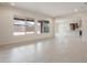 Bright living room, open floor plan, looks into kitchen at 22444 E Orchard Ln, Queen Creek, AZ 85142