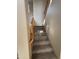 Carpeted staircase with wooden railing leading to the upper level at 38730 N Donovan Ln, Phoenix, AZ 85086