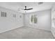 Well-lit bedroom with ceiling fan and window at 3704 W Vivian Ct, Phoenix, AZ 85086