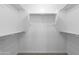 Spacious walk-in closet with double hanging rods and shelving at 3704 W Vivian Ct, Phoenix, AZ 85086