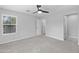 Bedroom with ceiling fan and access to hallway at 3704 W Vivian Ct, Phoenix, AZ 85086