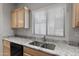 Kitchen sink with granite countertop and stainless steel double sink at 3704 W Vivian Ct, Phoenix, AZ 85086