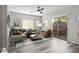Virtually staged living room with patio access and modern furniture at 3704 W Vivian Ct, Phoenix, AZ 85086