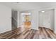 Living room with laminate floors and views of kitchen and staircase at 3704 W Vivian Ct, Phoenix, AZ 85086