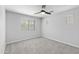 Spacious bedroom with ceiling fan and window at 3704 W Vivian Ct, Phoenix, AZ 85086