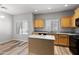 Bright kitchen with light wood cabinets, granite countertops, and stainless steel appliances at 3704 W Vivian Ct, Phoenix, AZ 85086