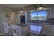 Updated kitchen with granite countertops and island seating at 37760 N Concho Dr, Carefree, AZ 85377