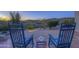 Relaxing patio with rocking chairs and desert views at 37760 N Concho Dr, Carefree, AZ 85377
