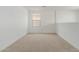 Simple bedroom with carpet and a single window at 17065 W Molly Ln, Surprise, AZ 85387