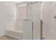 Bathroom with shower, tub, and window at 17065 W Molly Ln, Surprise, AZ 85387