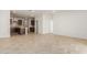 Open living space with tile flooring and access to the backyard at 17065 W Molly Ln, Surprise, AZ 85387