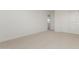 Bright bedroom with carpet, door and double-door closet at 17065 W Molly Ln, Surprise, AZ 85387