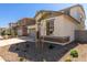 Two-story house with landscaped front yard and neutral exterior finishes at 17065 W Molly Ln, Surprise, AZ 85387
