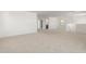 Spacious loft area with carpeted flooring and window at 17065 W Molly Ln, Surprise, AZ 85387