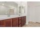 Modern bathroom with double vanity and large mirror at 17065 W Molly Ln, Surprise, AZ 85387