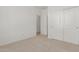 Simple bedroom with carpet flooring and double door closet at 17065 W Molly Ln, Surprise, AZ 85387