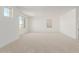 Large bedroom with plush carpet and large windows at 17065 W Molly Ln, Surprise, AZ 85387
