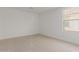 Spacious bedroom featuring a window and neutral walls at 17065 W Molly Ln, Surprise, AZ 85387