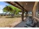 Covered porch with seating area overlooking the yard at 22020 E Stoney Vista Dr, Queen Creek, AZ 85142