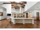 Open kitchen with a large island and exposed wood beams at 5842 E Redwing Rd, Paradise Valley, AZ 85253