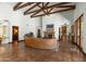 Grand great room features hardwood floors, wood beam ceilings, and a comfortable seating area at 5842 E Redwing Rd, Paradise Valley, AZ 85253