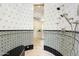 Large walk-in shower with patterned tile and bench at 5842 E Redwing Rd, Paradise Valley, AZ 85253