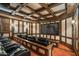 State-of-the-art home theater with comfortable seating and a large projection screen at 5842 E Redwing Rd, Paradise Valley, AZ 85253