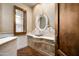 Powder room with ornate vanity, decorative mirror, and hardwood floors at 5842 E Redwing Rd, Paradise Valley, AZ 85253