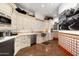Elegant kitchen features custom cabinetry, high-end appliances, and decorative tile at 5842 E Redwing Rd, Paradise Valley, AZ 85253