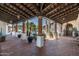 Brick courtyard with covered walkway and lush greenery at 5842 E Redwing Rd, Paradise Valley, AZ 85253