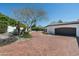 Private garage with brick driveway and desert landscaping at 5842 E Redwing Rd, Paradise Valley, AZ 85253