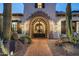 Elegant entry gate with ironwork and desert landscaping at 5842 E Redwing Rd, Paradise Valley, AZ 85253