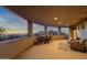 Large covered patio with seating and mountain views at 10751 E Candlewood Dr, Scottsdale, AZ 85255