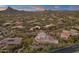 Luxury homes and desert landscape in a gated community at 10751 E Candlewood Dr, Scottsdale, AZ 85255
