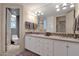 Elegant bathroom with double sinks and a large mirror at 10751 E Candlewood Dr, Scottsdale, AZ 85255