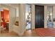 Entryway with stained glass and powder room at 10751 E Candlewood Dr, Scottsdale, AZ 85255