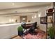 Home office features a desk, chair, and shelving at 10751 E Candlewood Dr, Scottsdale, AZ 85255