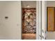 Custom built-in wine cellar with ample storage at 10751 E Candlewood Dr, Scottsdale, AZ 85255