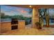 Outdoor kitchen and patio with mountain views at 10751 E Candlewood Dr, Scottsdale, AZ 85255