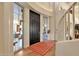 Bright entryway with hardwood floors and stained glass at 10751 E Candlewood Dr, Scottsdale, AZ 85255