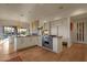 Open concept kitchen with island and access to backyard at 10751 E Candlewood Dr, Scottsdale, AZ 85255