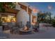 Relaxing patio area with fire pit and comfortable seating at 10751 E Candlewood Dr, Scottsdale, AZ 85255