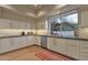 Bright kitchen with granite countertops and a view from the window at 10751 E Candlewood Dr, Scottsdale, AZ 85255