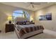 Spacious bedroom with a large window and cozy bedding at 10751 E Candlewood Dr, Scottsdale, AZ 85255