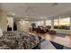 Large bedroom with a sitting area and mountain views at 10751 E Candlewood Dr, Scottsdale, AZ 85255