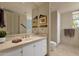 Clean bathroom with double vanity and a toilet at 10751 E Candlewood Dr, Scottsdale, AZ 85255